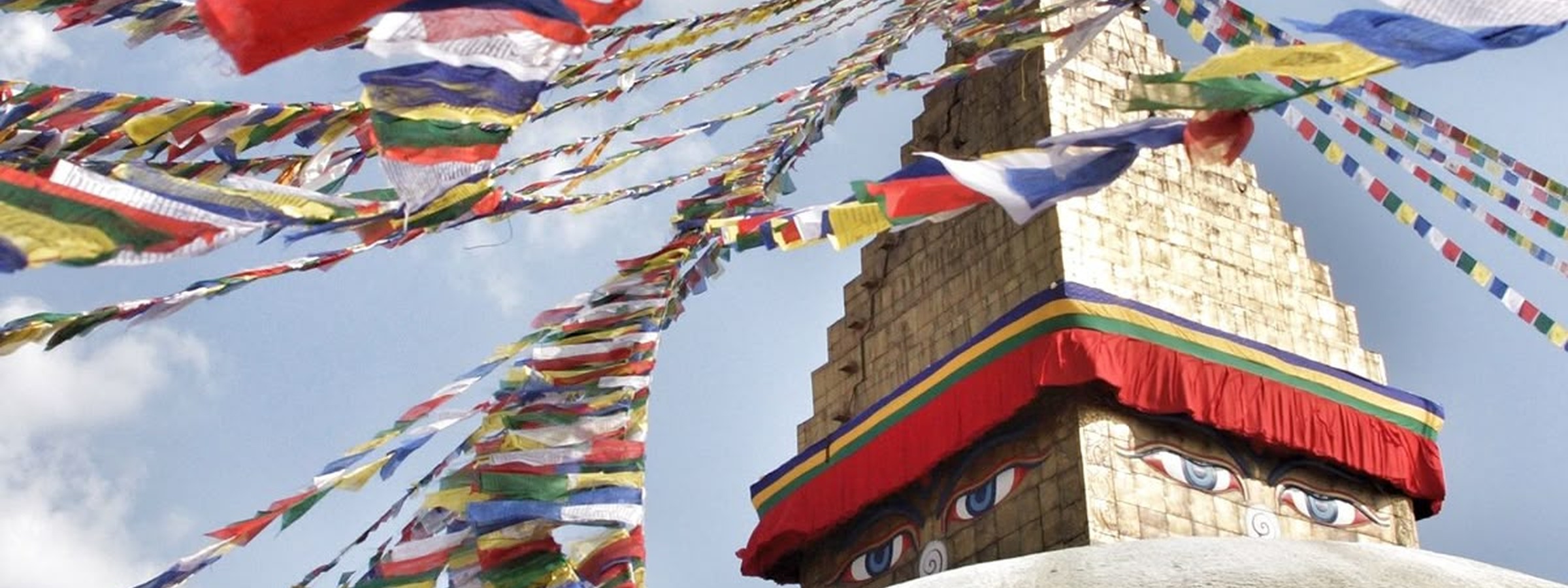 Prayer flags surrounding a Buddhist stupa in Nepal.